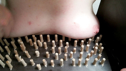 Tit punishing machine