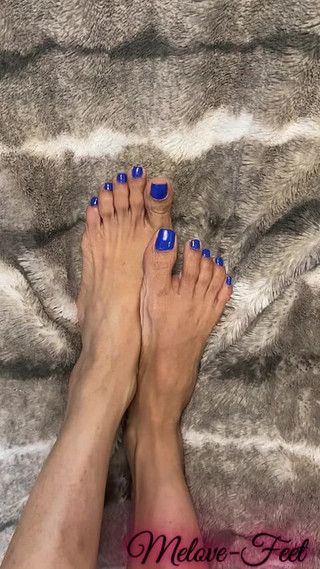 Melove Showing Her Blue Nail Polish on Her Small Feet