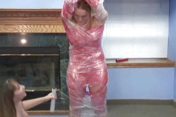 Blonde lesbo pussy dildoed while hanging from the ceiling in tape bondage