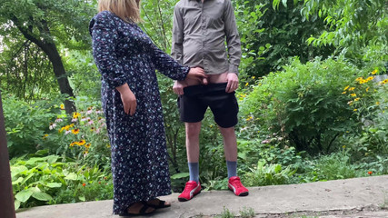 Stepmom MILF helps her stepson pee outside and pee standing herself