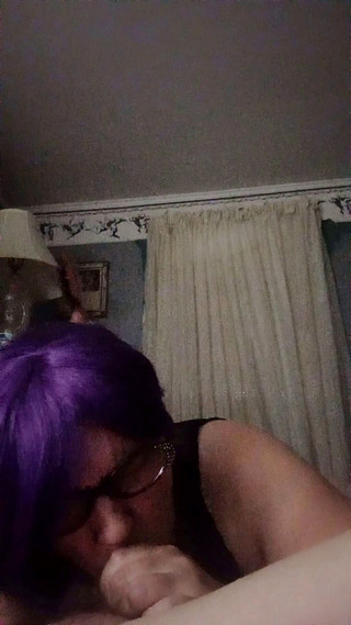 Sucking cock while getting spanked.