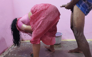 Aunty is cleaning the floor when a young boy has sex with her