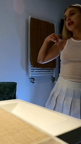 Cute and Hot Sexy Tight Pussy Cheerleader Shows Her Shaved and Wet Pussy Under Her Mini Skirt in the Bathroom