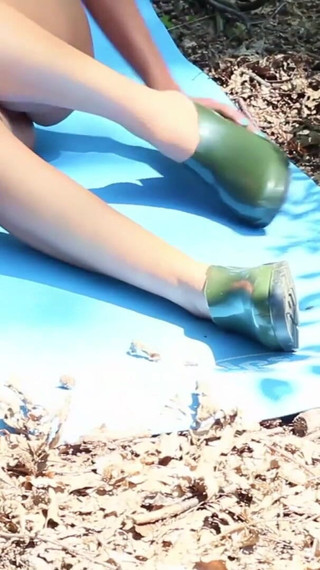 Naked Teen in the Woods Uses Scissors to Cut Her Latex Boots Into Confortable Shoes