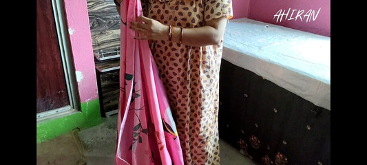 Indian Girl Folding Clothes in Her Bedroom