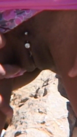 Canele: Canele Having a Good Piss on the Rock