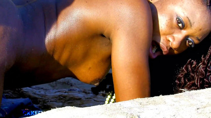 Ebony gets big white dick outdoors on the beach